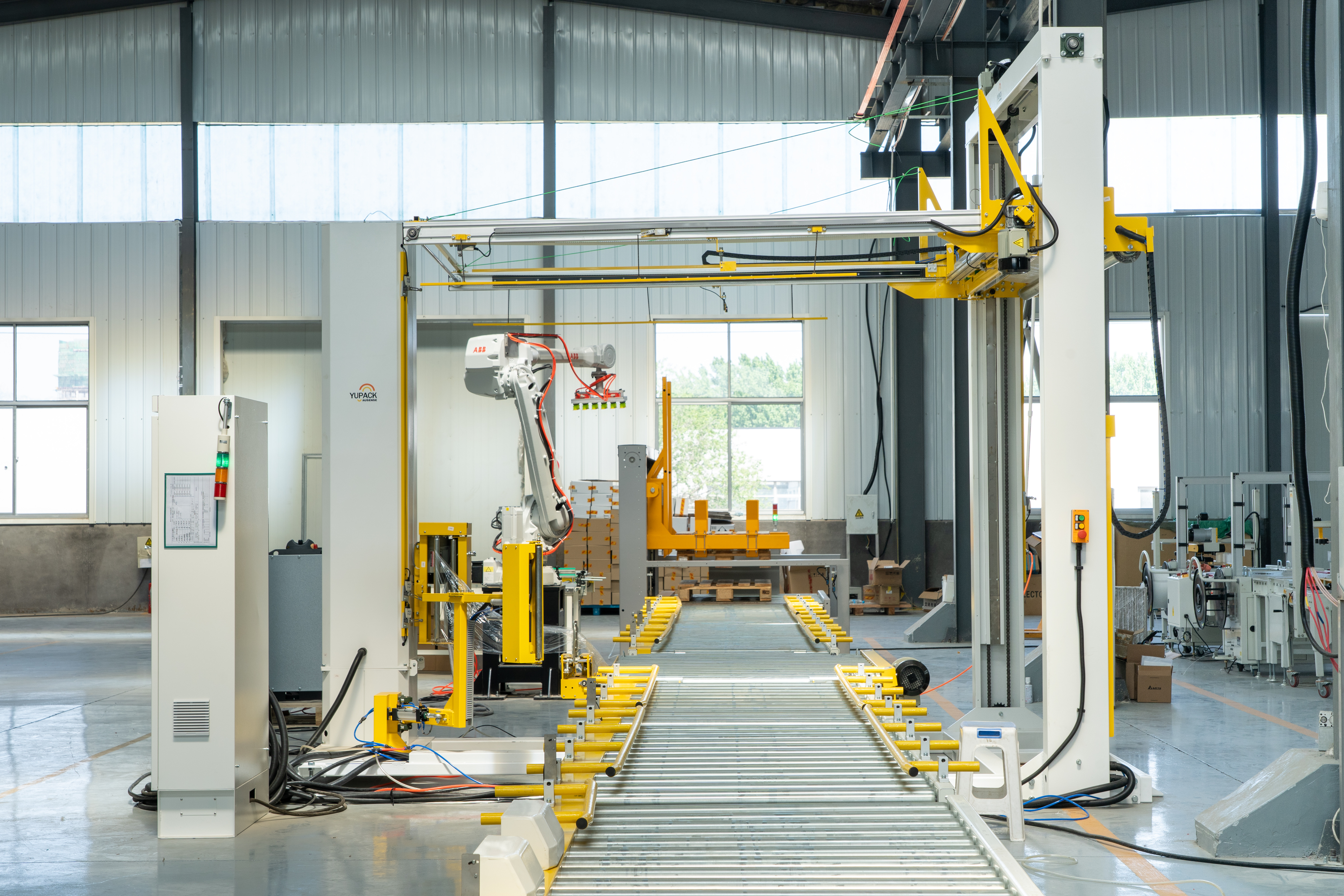 Turntable style stretch wrapper in operation